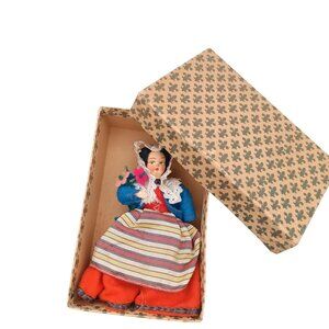 Vintage Folk Doll in Traditional Clothing with Striped Apron and Lace Details